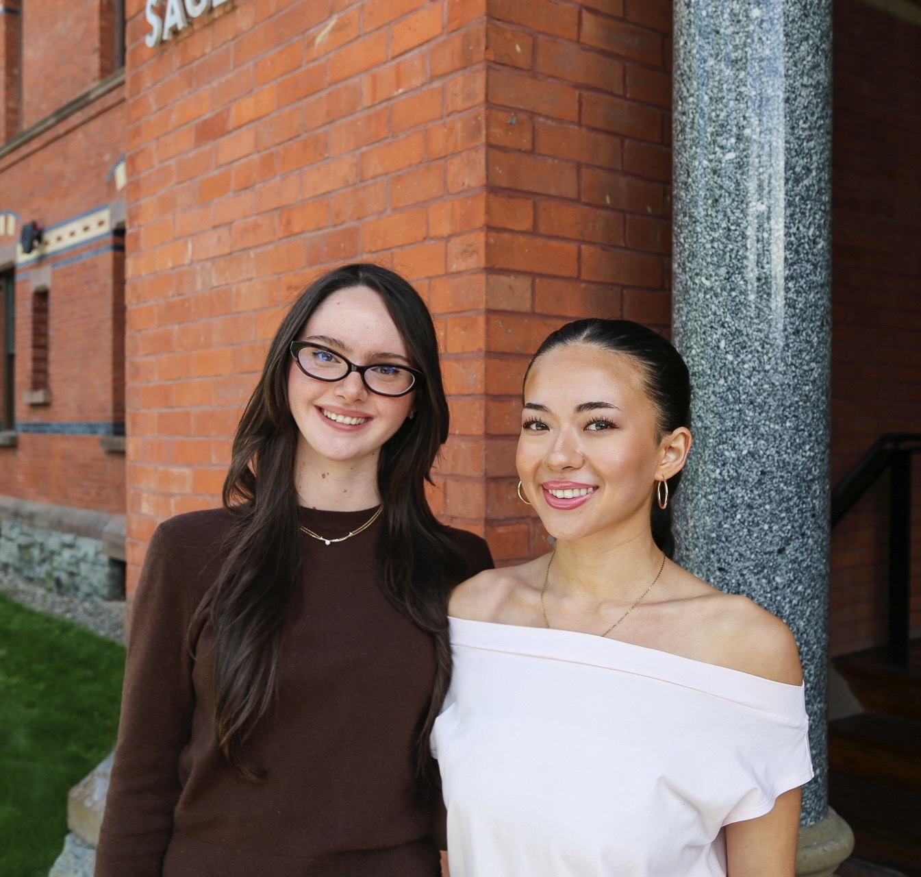 Goldroad co-founders Adriana Burnett and Sarah Van Horn together outside Sage Hall